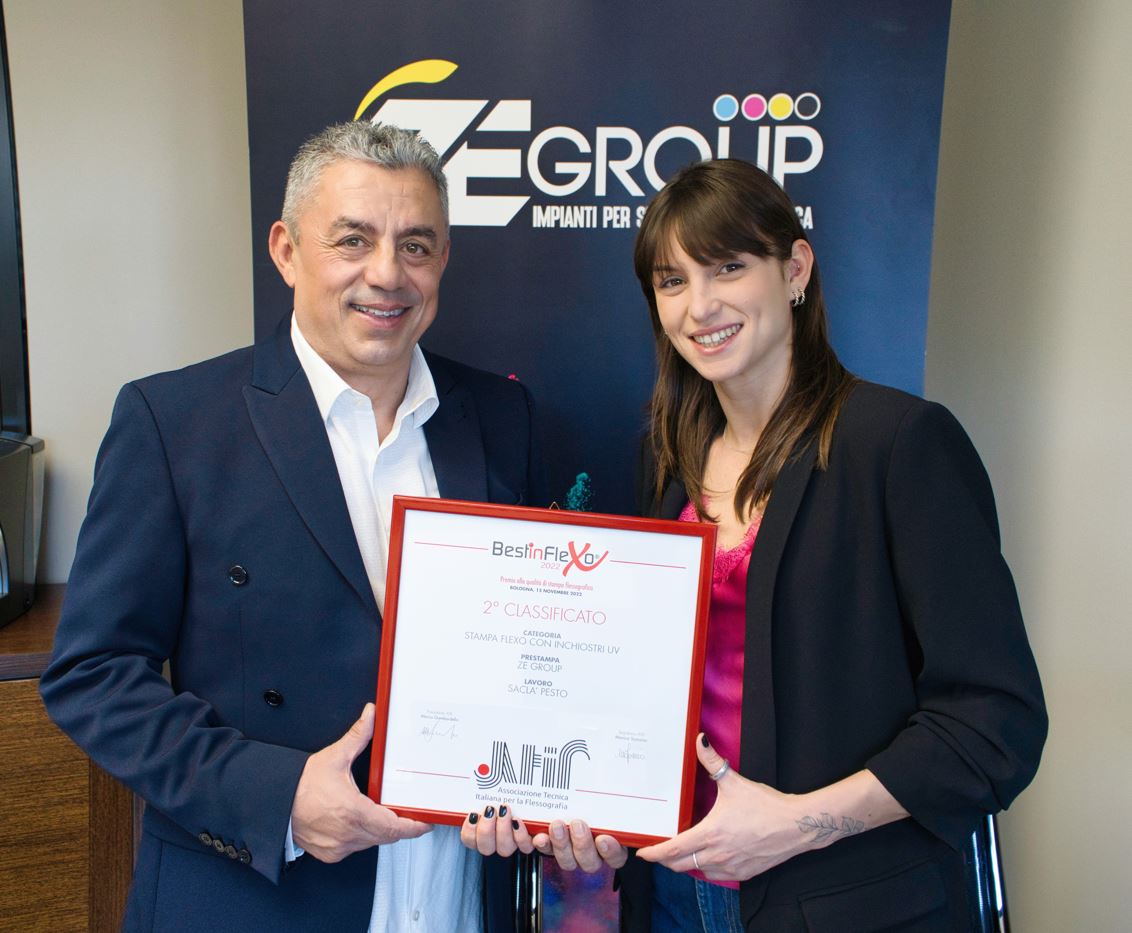 Owner, Sandro Bisoli next to co-owner Noemi Bisoli showing off the ATIF print award.